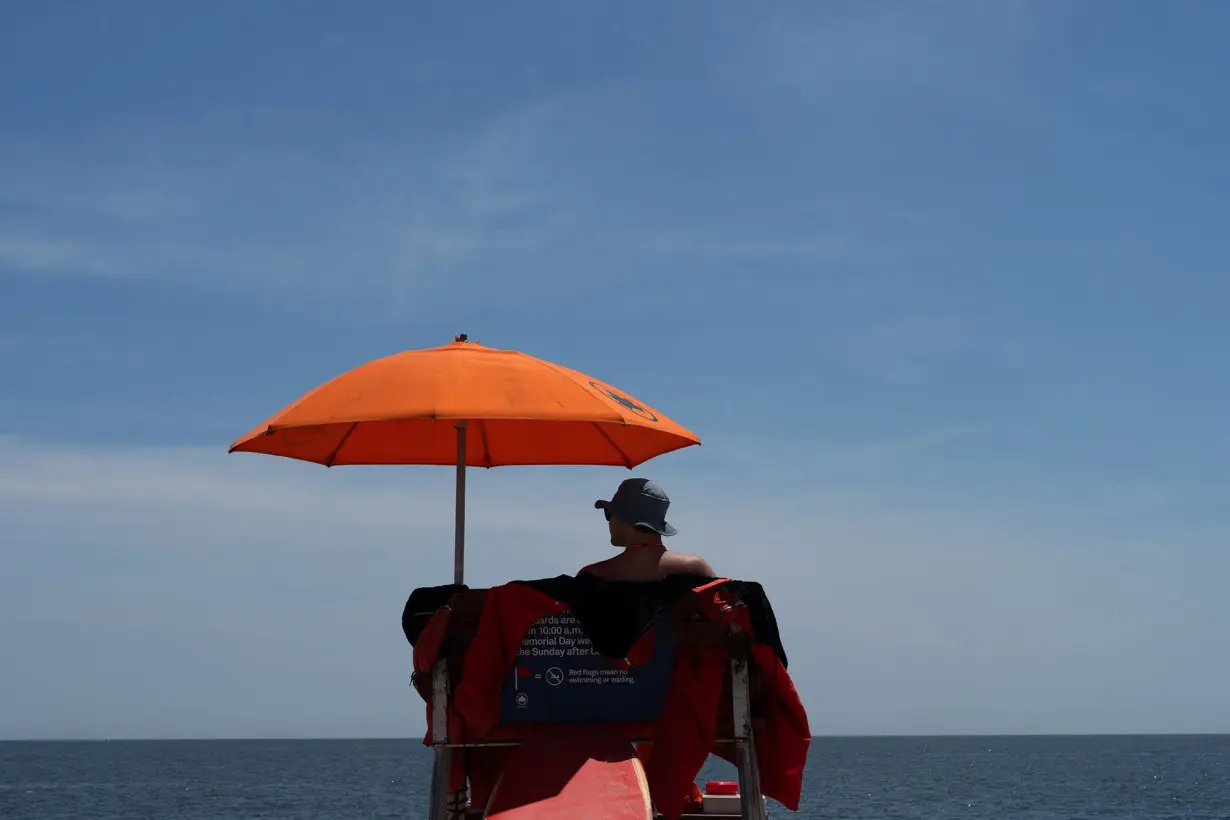 A lifeguard watches over the beach at Coney Island on May 25, 2024 in New York City. New York changed some of its lifeguard requirements to address an ongoing national lifeguard shortage.