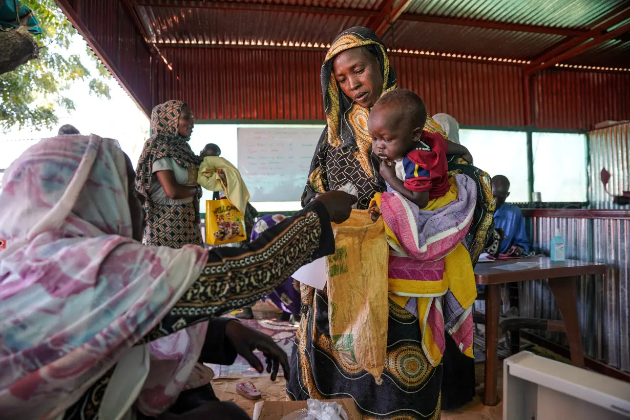 FILE PHOTO: Handout photograph of a woman and baby at the Zamzam displacement camp in North Darfur