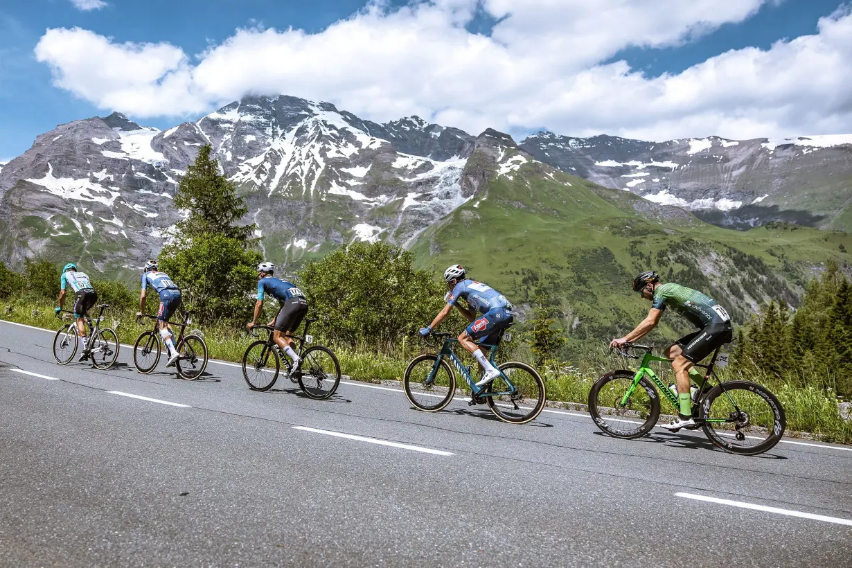 Cyclists (L-R) Italy's Samuele Zoccarato, Austria's Michael Gogl, Norway's André Drege, the Netherlands' Oscar Riesebeek and Germany's Jonas Rapp ride in a partly snow-covered mountain area on Saturday.