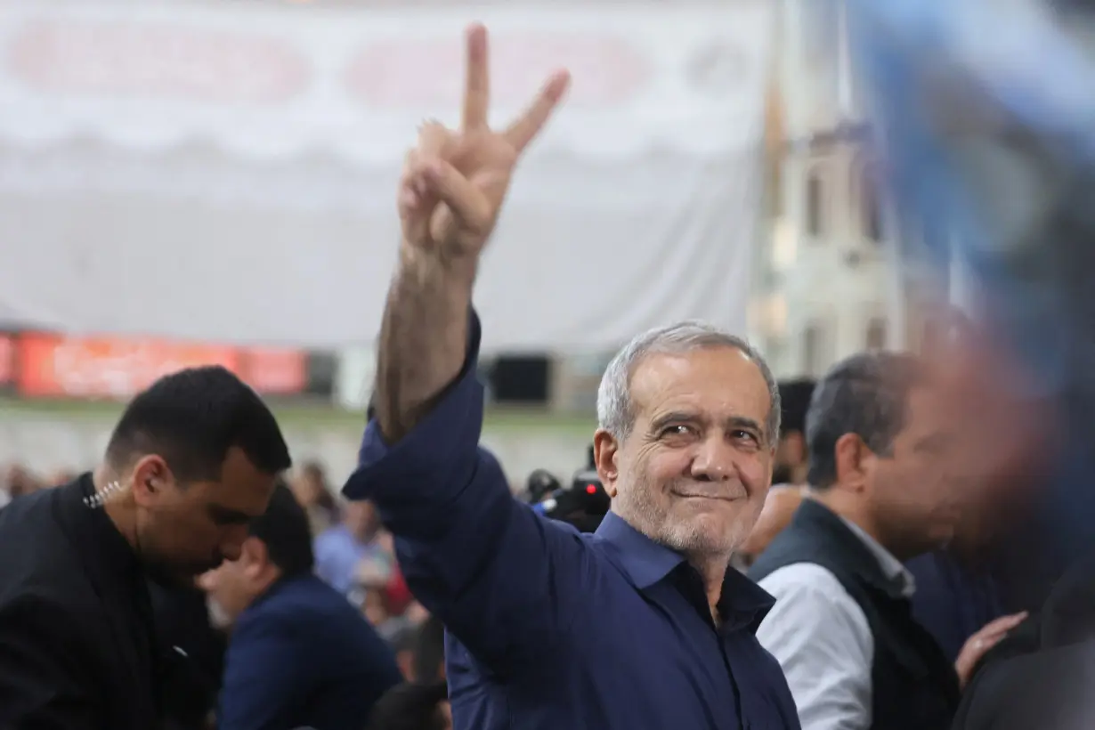 Iran's President-elect Masoud Pezeshkian gestures during a gathering with his supporters at the shrine of Iran's late leader Ayatollah Ruhollah Khomeini, in south of Tehran