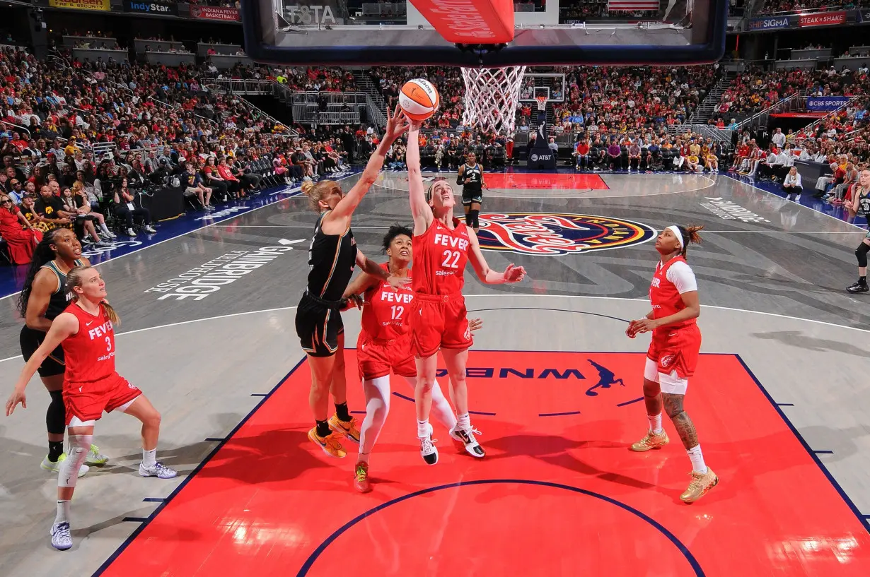 Clark (No. 22) grabs the rebound during the game against the New York Liberty on July 6, 2024 at Gainbridge Fieldhouse in Indianapolis, Indiana.