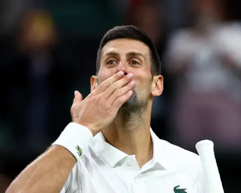 Tennis-Djokovic overcomes slow start to ease past Popyrin