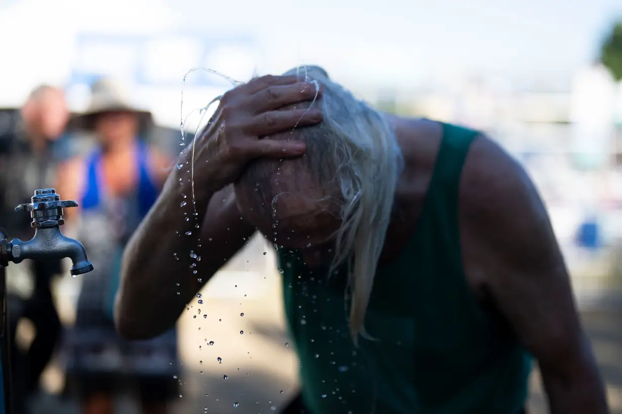 Death Valley sets a new daily record with a searing 128 degrees as West Coast heat wave drags on