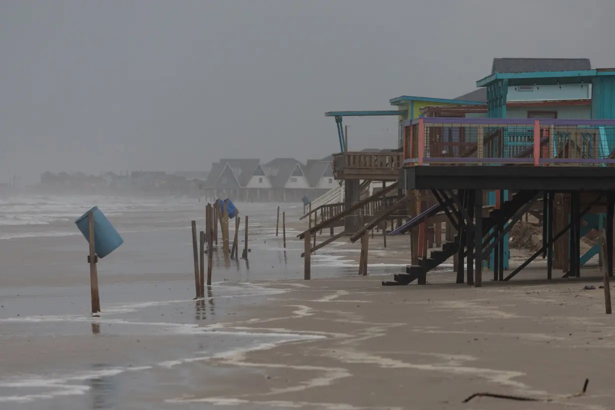 Rain and swells from Hurricane Beryl approach homes along Surfside Beach, Texas