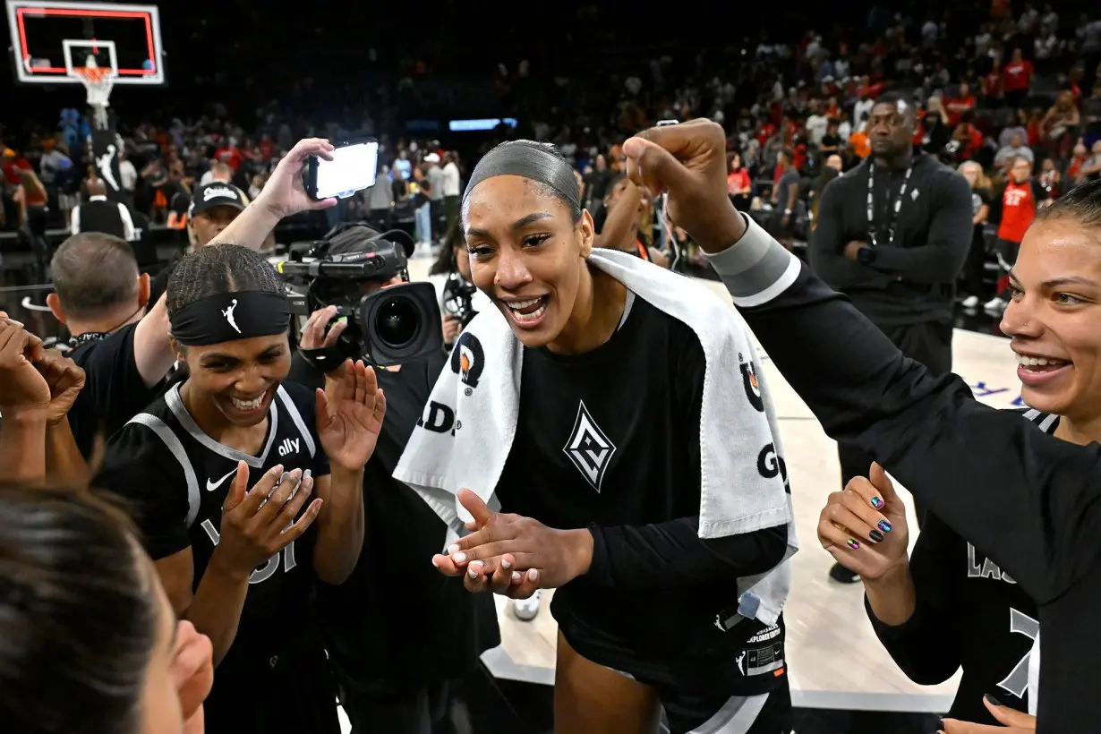 Wilson celebrates with her team after the game.