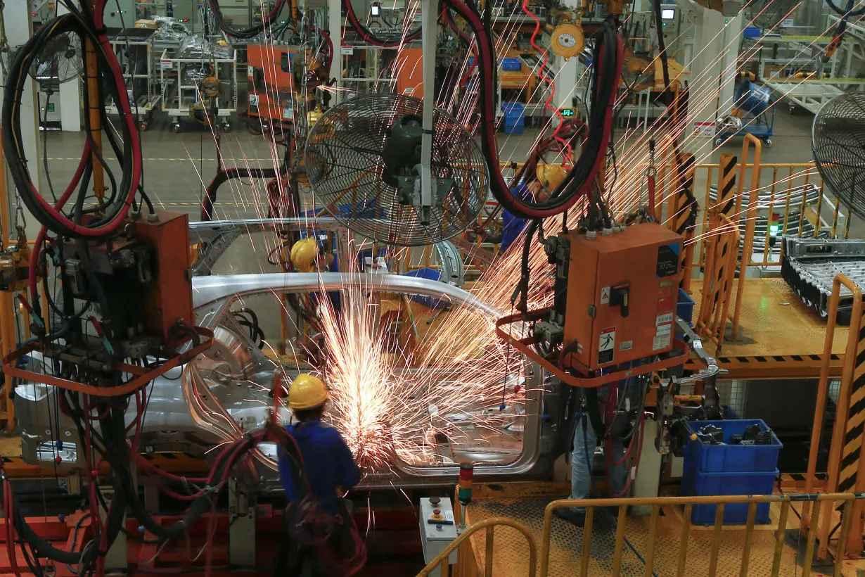 Cars are built at a BYD weld line in Shenzhen