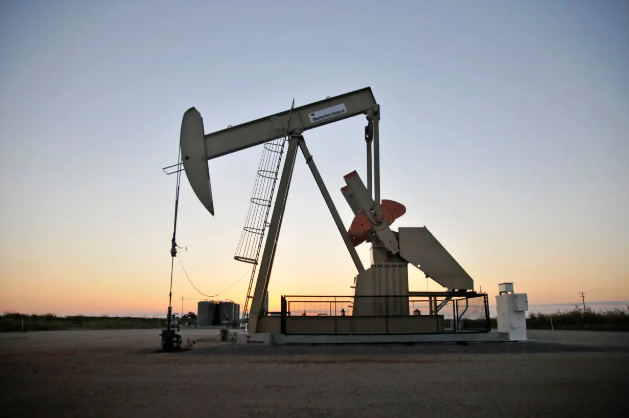 A pump jack operates at a well site leased by Devon Energy Production Company near Guthrie, Oklahoma