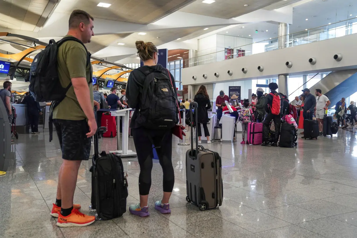 Passengers line up before their flights at Hartsfield-Jackson Atlanta International Airport