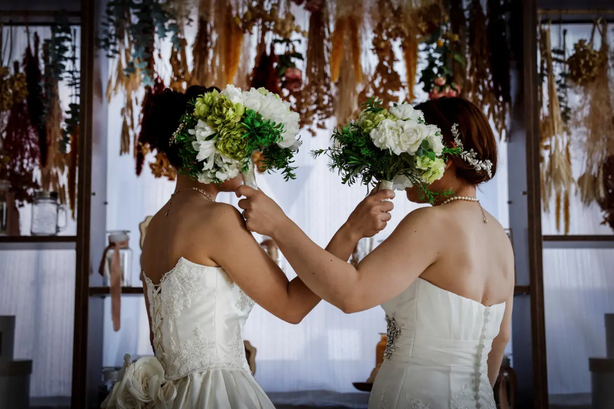 The Wider Image: Frustrated by Japan's same-sex marriage ban, LGBTQ couples opt for 'photo weddings'