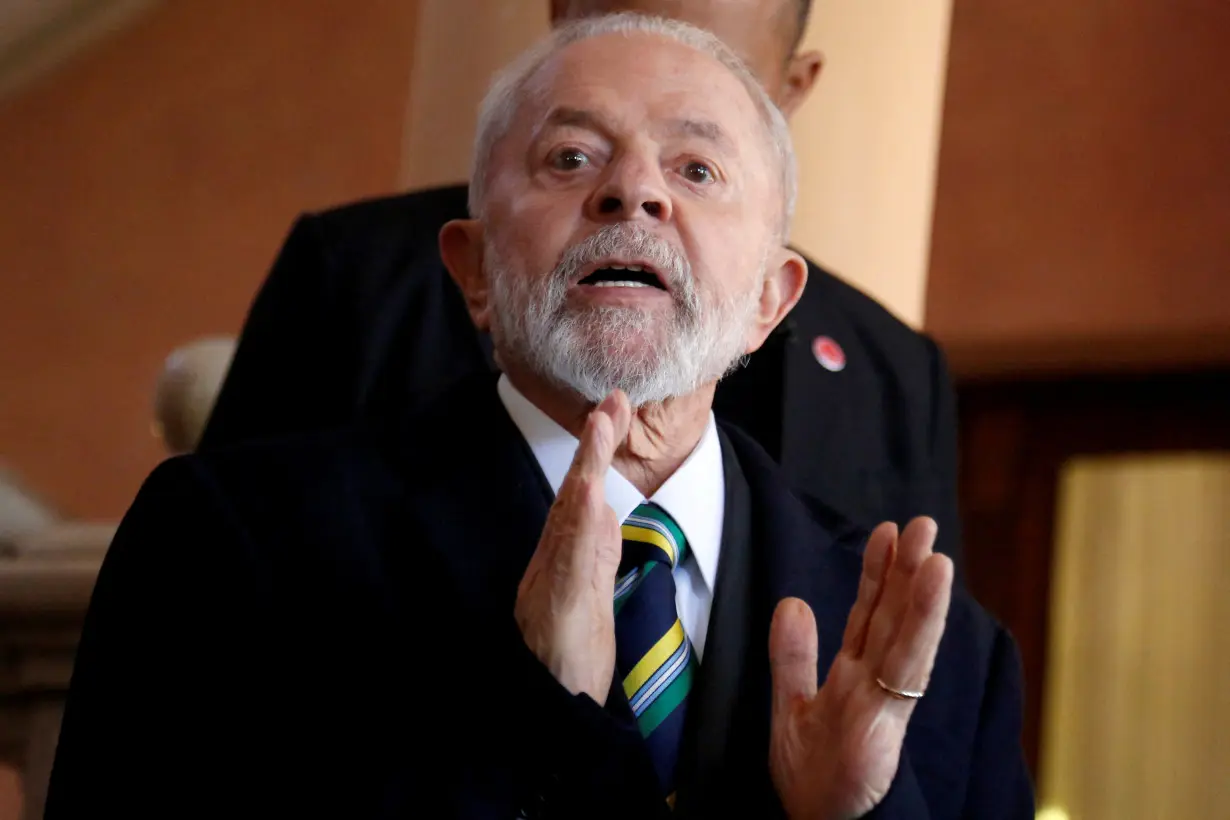 Brazil's President Luiz Inacio Lula da Silva gestures to media during the Mercosur summit in Asuncion