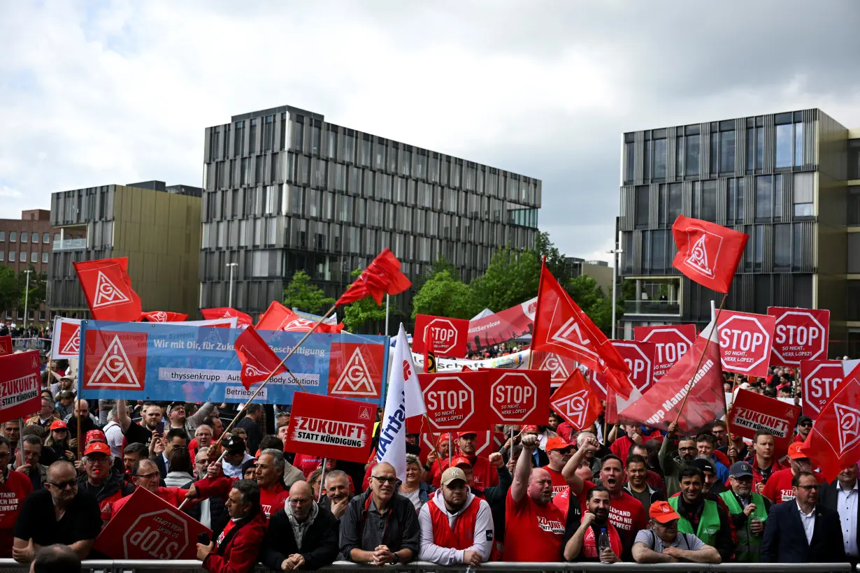 Thyssenkrupp steelworkers rally at an IG Metall union protest in Essen