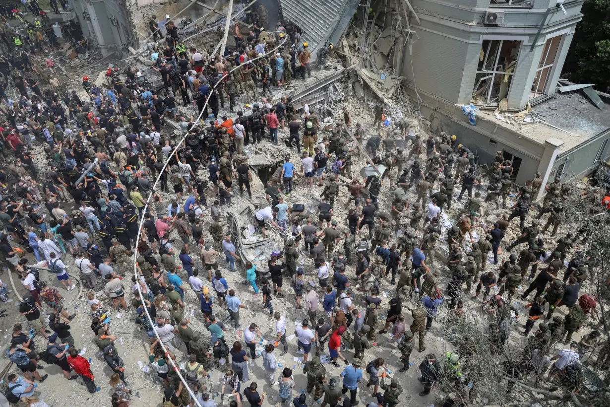 Rescuers and volunteers work at Ohmatdyt Children's Hospital that was damaged during Russian missile strikes, in Kyiv