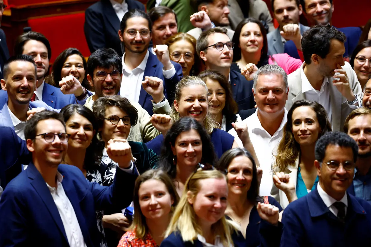 Newly-elected lawmakers make entry to the National Assembly in Paris