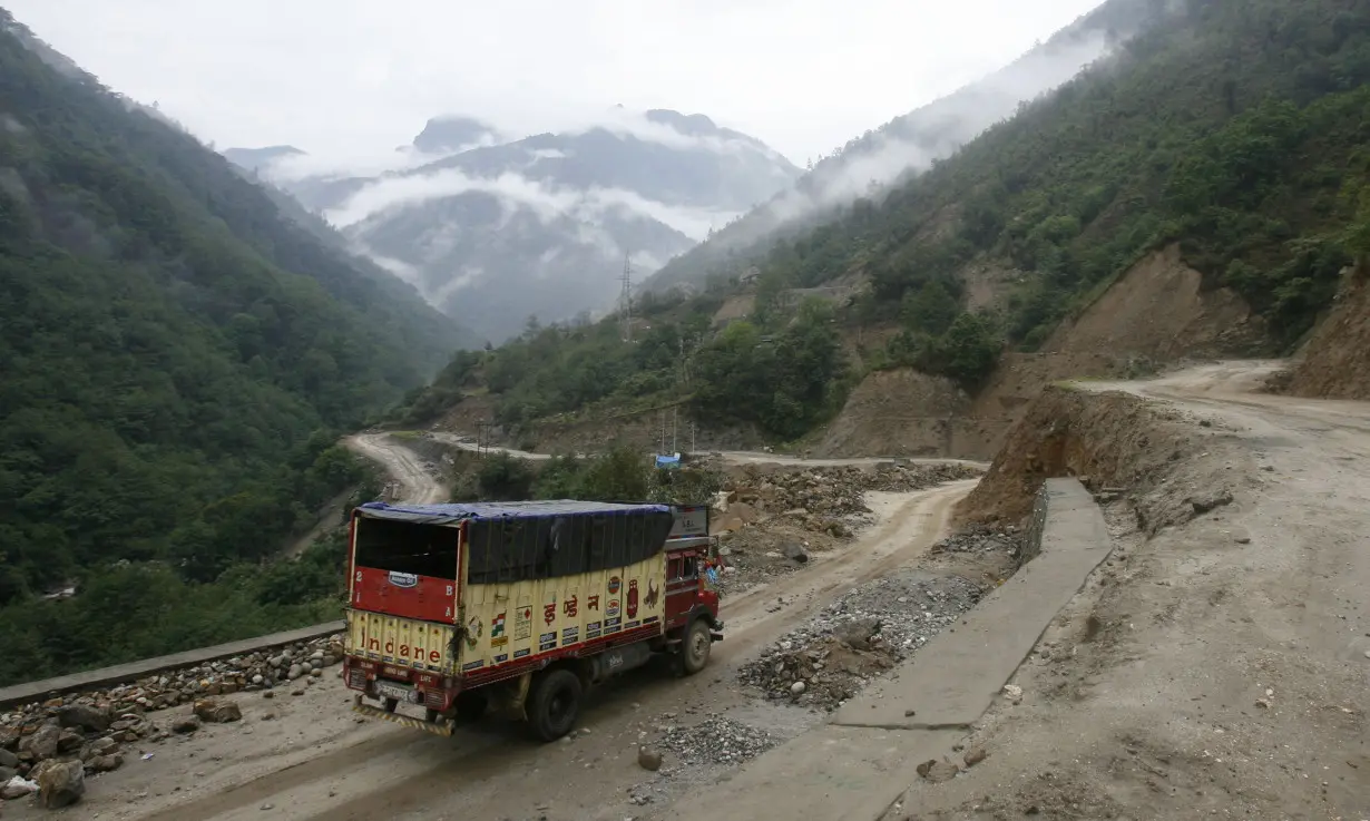 A liquefied petroleum gas delivery truck drives along India's Tezpur-Tawang highway which runs to the Chinese border, in the northeastern Indian state of Arunachal Pradesh