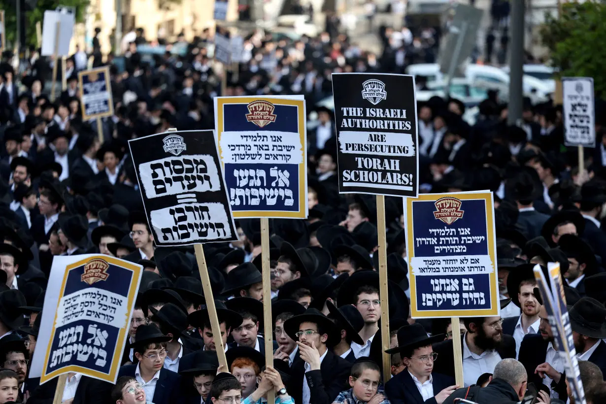 FILE PHOTO: Ultra-Orthodox Jewish men protest against attempts to change government policy that grants ultra-Orthodox Jews exemptions from military conscription, in Jerusalem