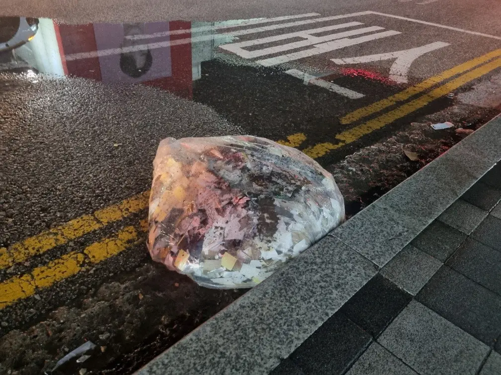 FILE PHOTO: A plastic bag carrying various objects including what appeared to be trash that crossed inter-Korean border with a balloon believed to have been sent by North Korea, is pictured in Seoul