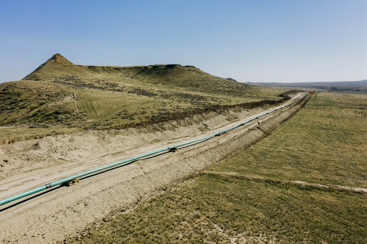 FILE PHOTO: An extension of Denbury Inc's Greencore carbon pipeline is ready to be lowered into its trench, in Montana