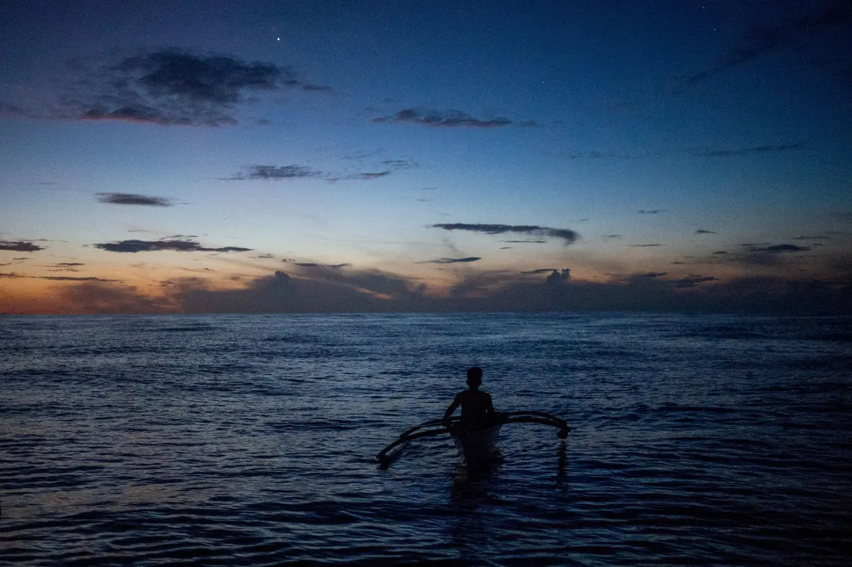 FILE PHOTO: Filipino fishermen in Masinloc, Zambales