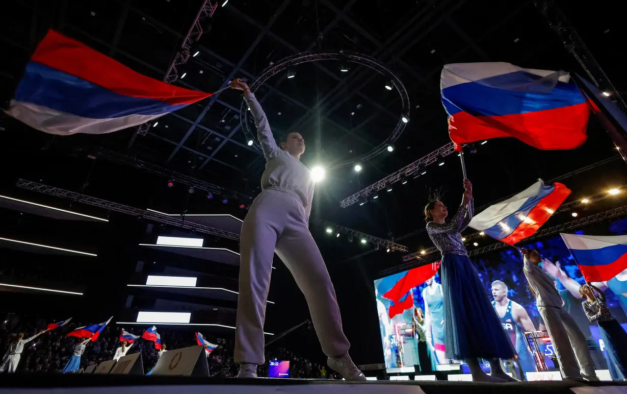 Russian wrestlers set on competing in Paris Olympics despite bans on team mates