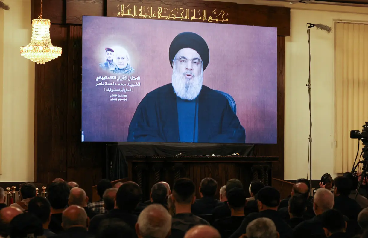 Lebanon's Hezbollah leader Sayyed Hassan Nasrallah speaks during a televised address at a memorial service for Mohammed Nasser, in Beirut