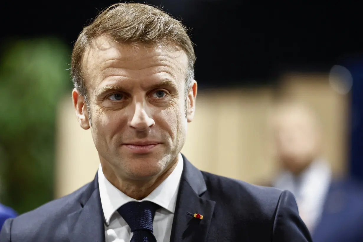 French President Macron votes in the second round of French parliamentary elections