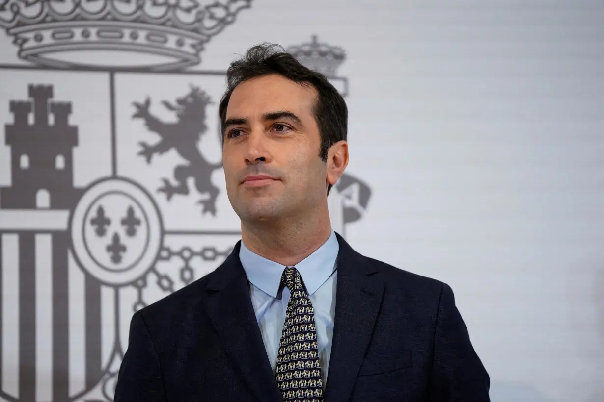 Spain's new Minister for Economy, Trade and Companies, Carlos Cuerpo is handed over his portfolio in Madrid.