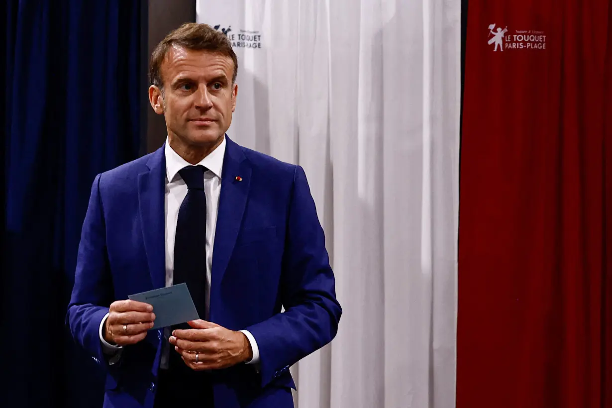 French President Macron votes in the first round of the 2024 snap legislative elections