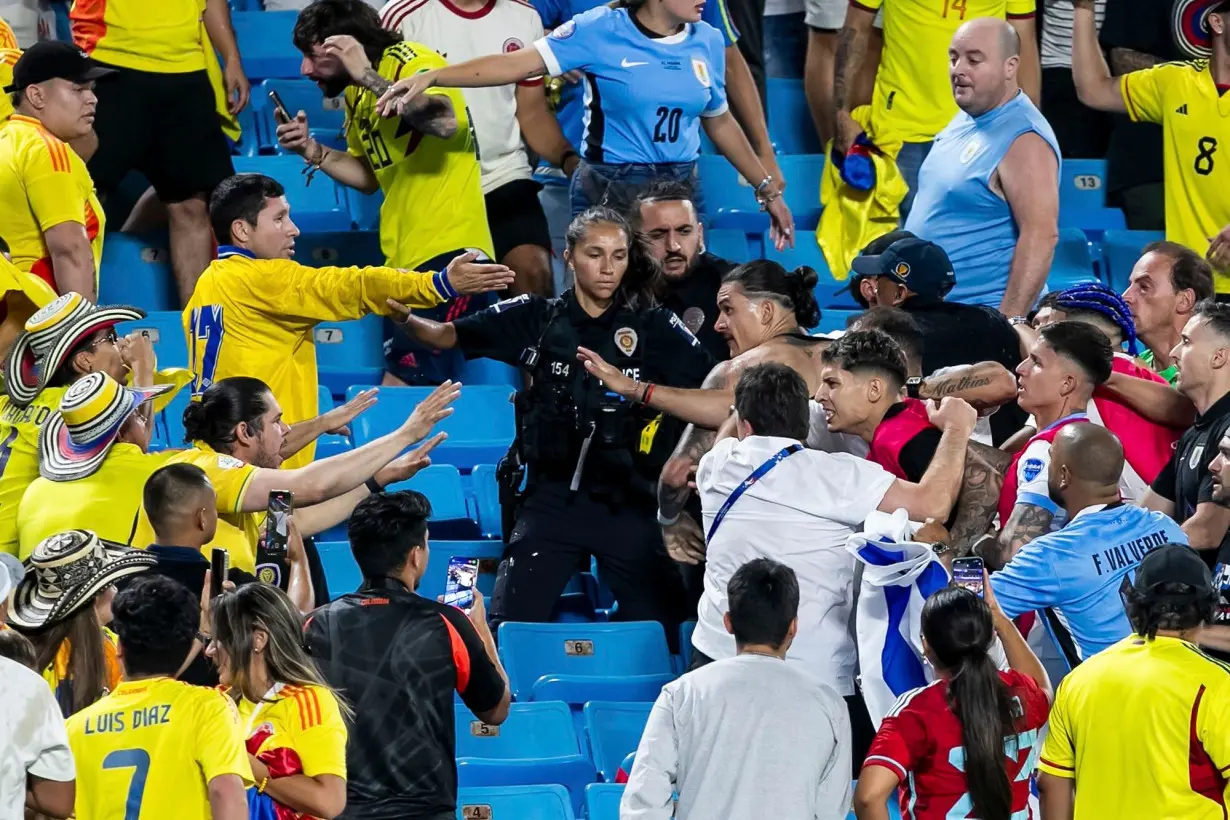 Uruguay forward Darwin Núñez clashes with Colombia fans after the semifinal.