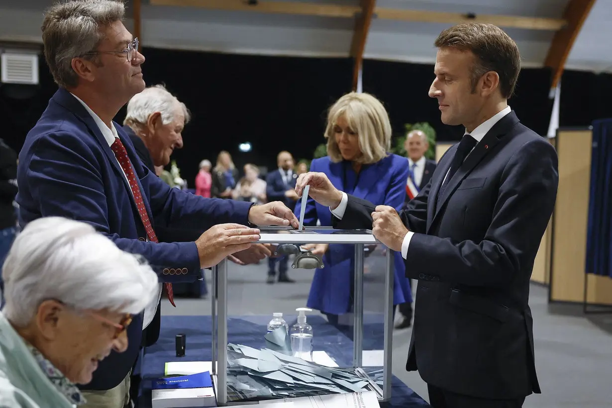 Macron urges new mainstream coalition, appearing to rule out working with the far left