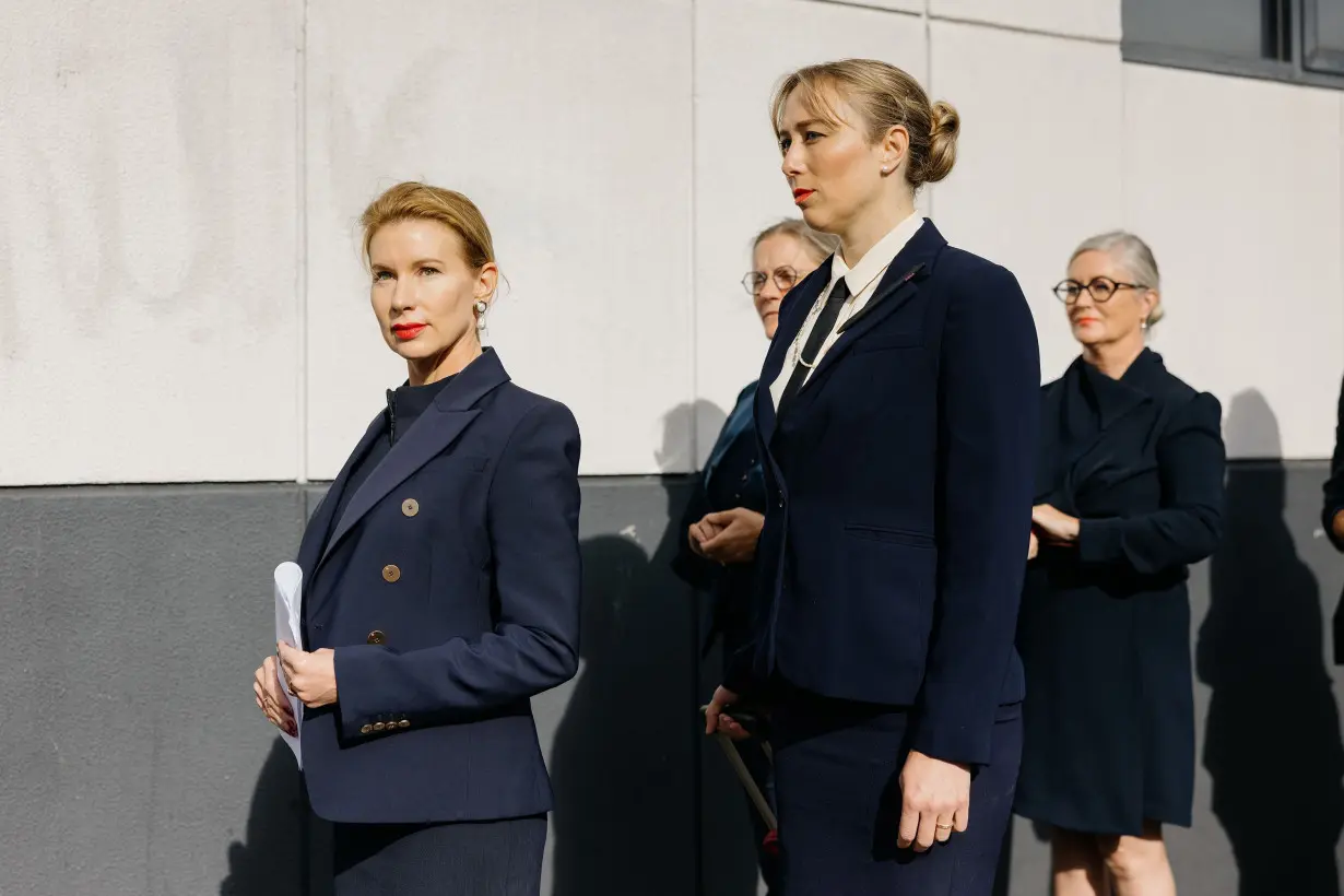 Kaechele and her navy-clad entourage outside the tribunal.