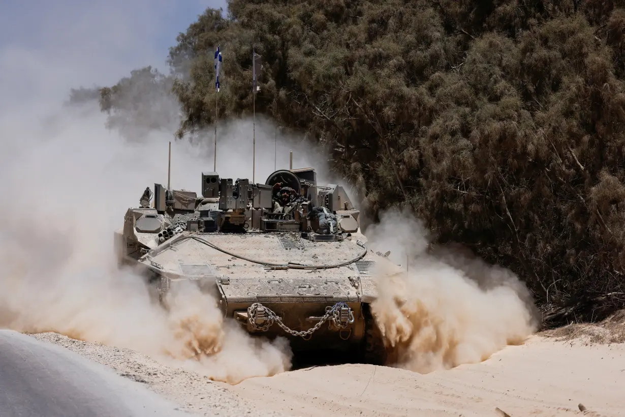 FILE PHOTO: An Israeli military vehicle manoeuvres near the Israel-Gaza border