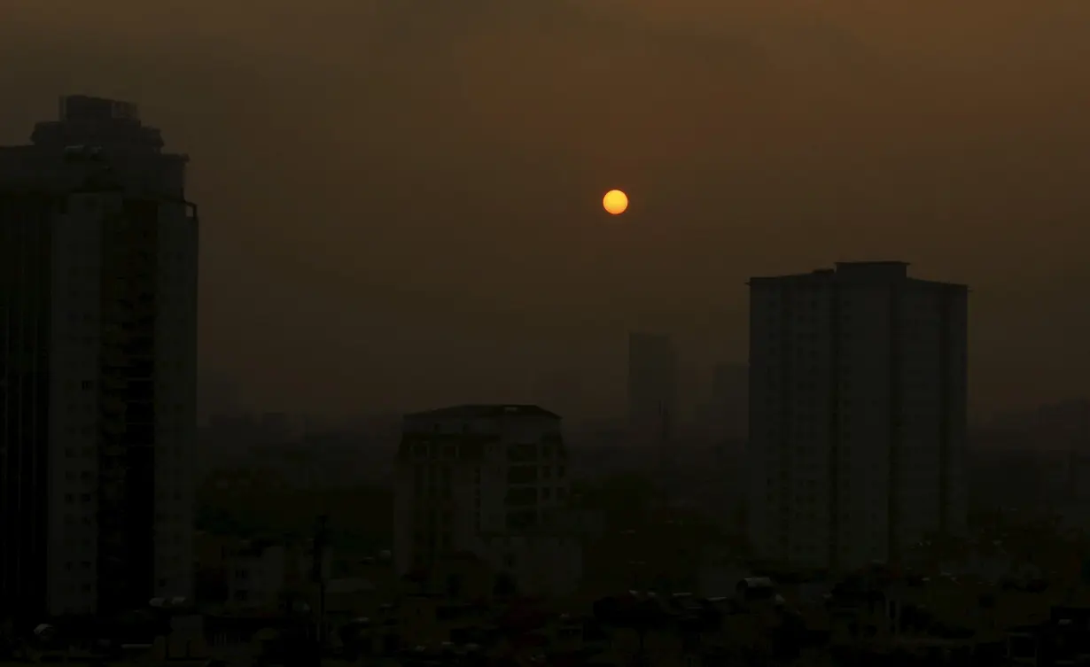 The sun rises over Hanoi's skyline