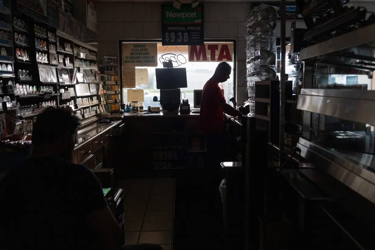 Convenience store runs without electricity after Hurricane Beryl in Oyster Creek, Texas