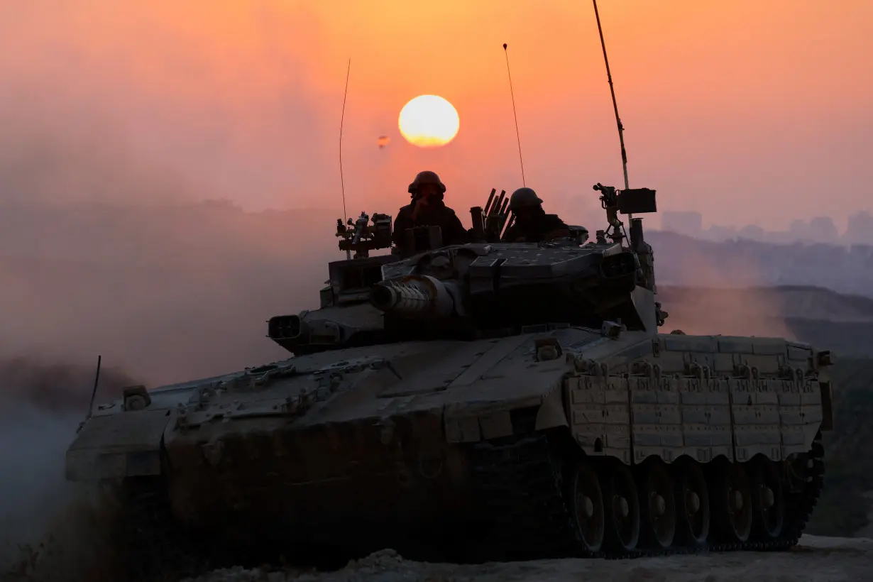 An Israeli tank manoeuvres, amid the Israel-Hamas conflict, near the Israel-Gaza border, in Israel