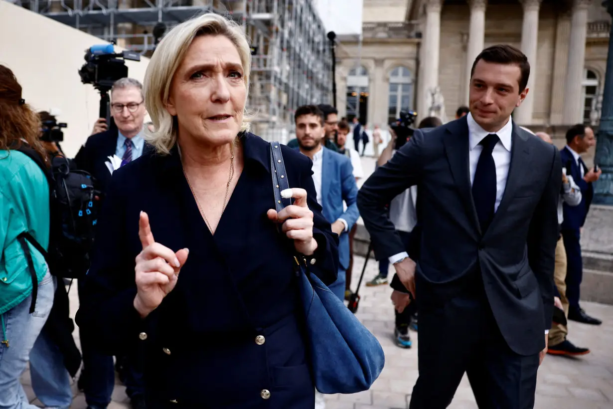 Newly elected lawmakers make entry to the National Assembly in Paris