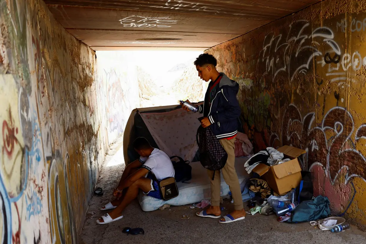 Moroccan migrants live in a ravine in Arinaga