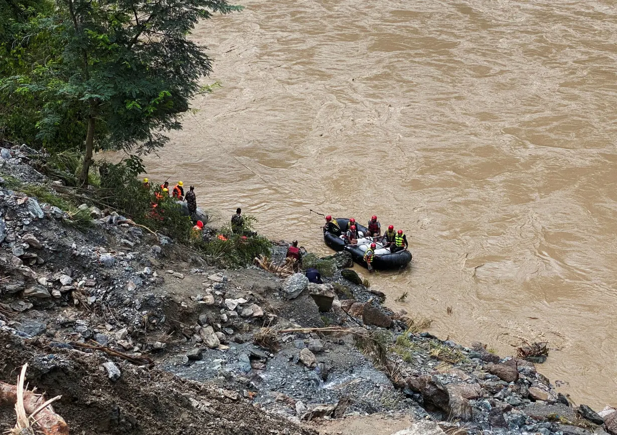 Nepal searches for people missing after landslides sweep two buses into river