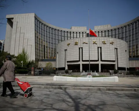 Institutions snapping up Chinese treasury bonds are shorting the economy, state media says