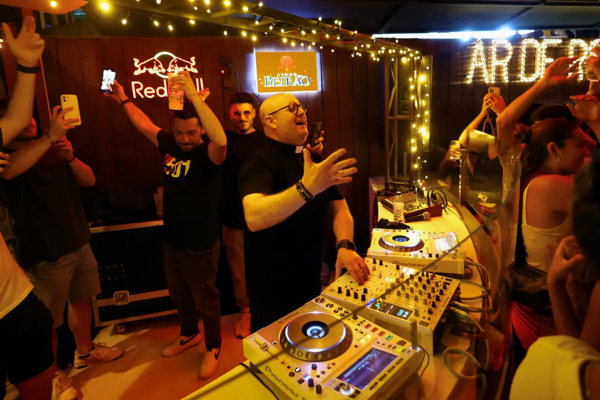 DJ priest Guilherme plays music in the parish bar of Laundos, Povoa do Varzim