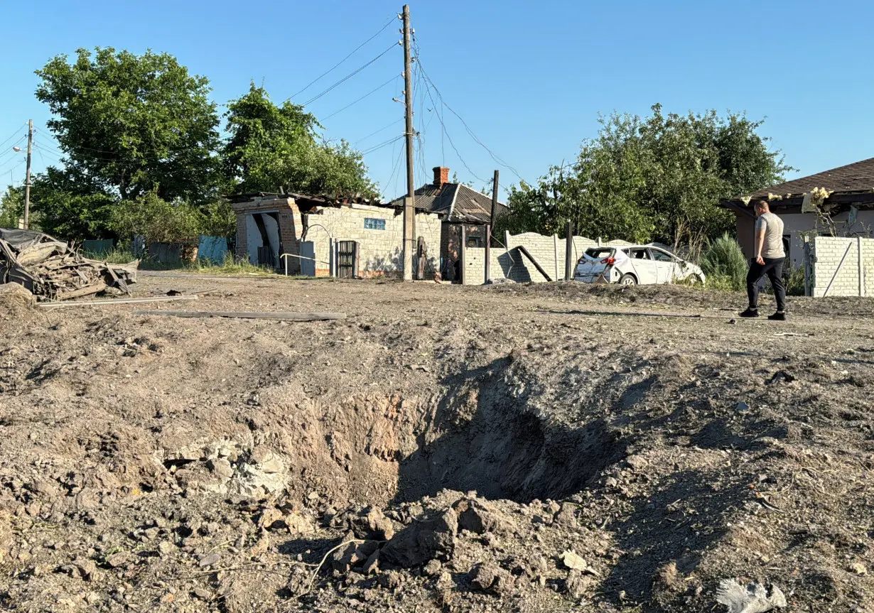 Aftermath of a Russian missile attack in the village of Budy