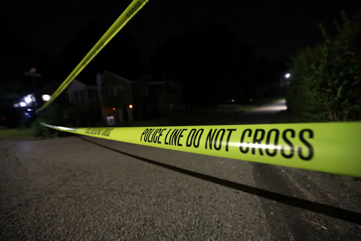 Law enforcement members guard the perimeter of the home of Republican presidential candidate and former U.S. President Donald Trump's shooting suspect