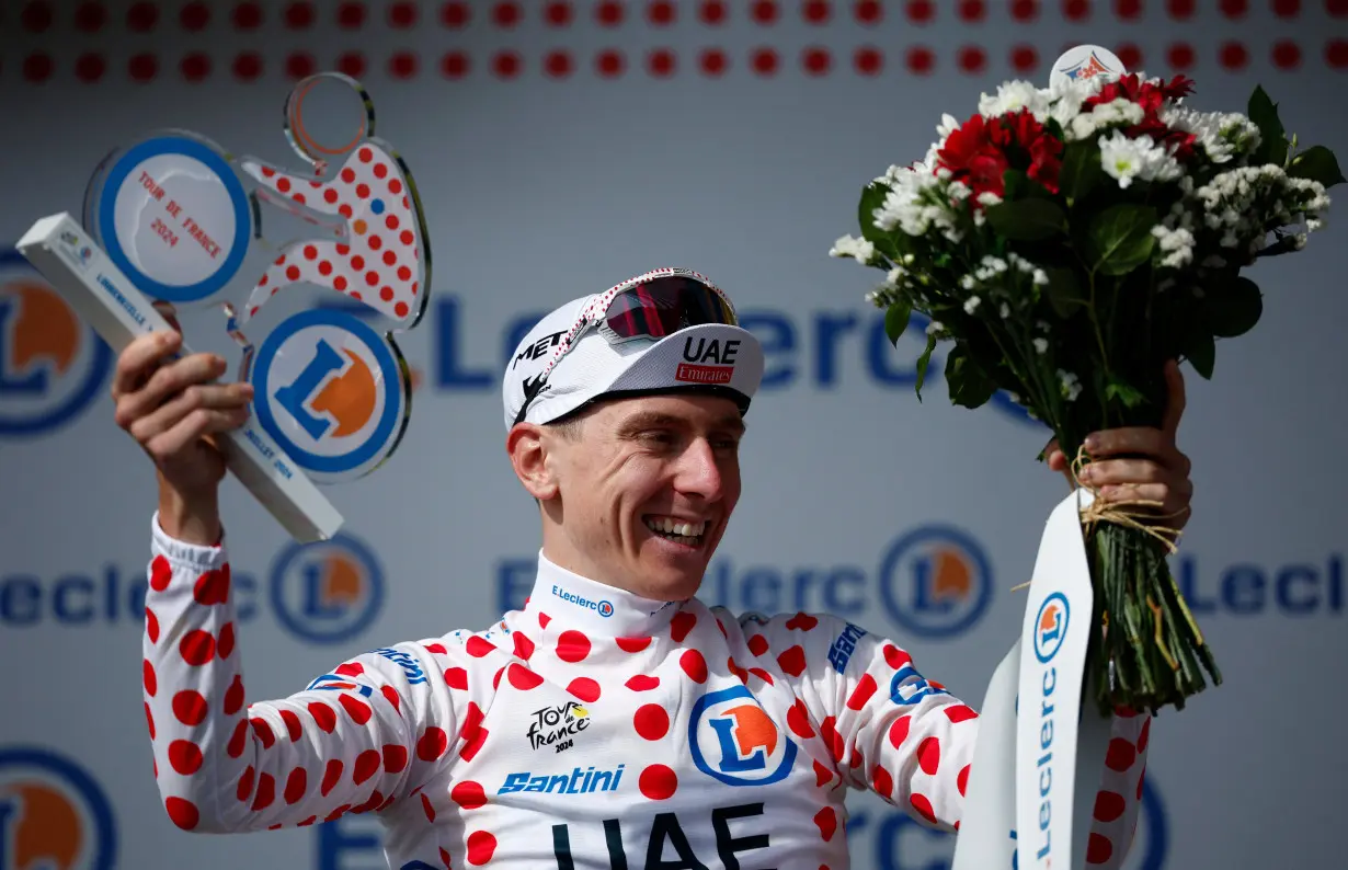 Cycling-Pogacar rides solo to stage 15 win, extends Tour lead