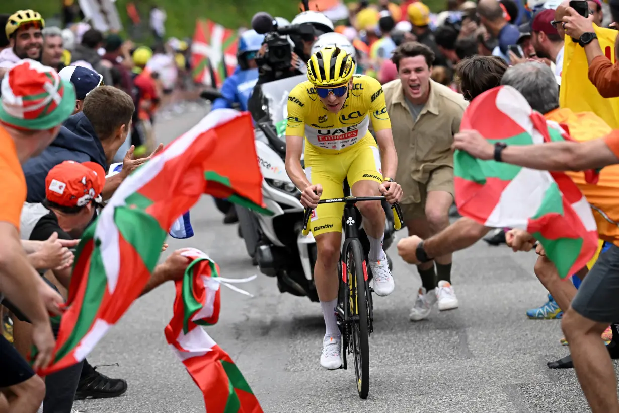 Cycling-Pogacar rides solo to stage 15 win, extends Tour lead