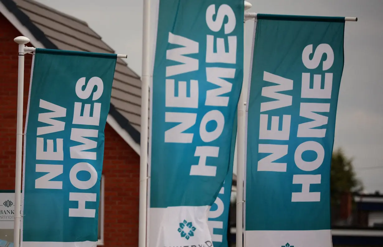 FILE PHOTO: Banners advertising new houses for sale on a new housing development