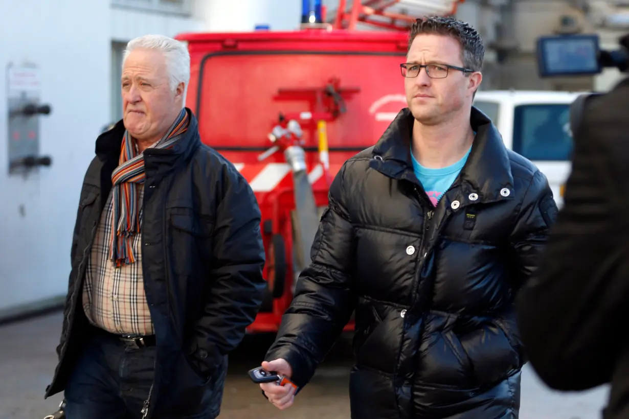 Rolf and Ralf Schumacher, father and brother of former Formula One world champion Michael Schumacher respectively, arrive at CHU hospital emergency unit in Grenoble, French Alps