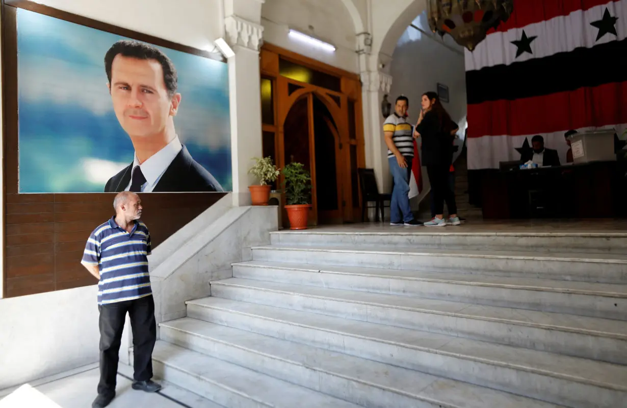 Syrians vote in parliamentary elections, in Damascus