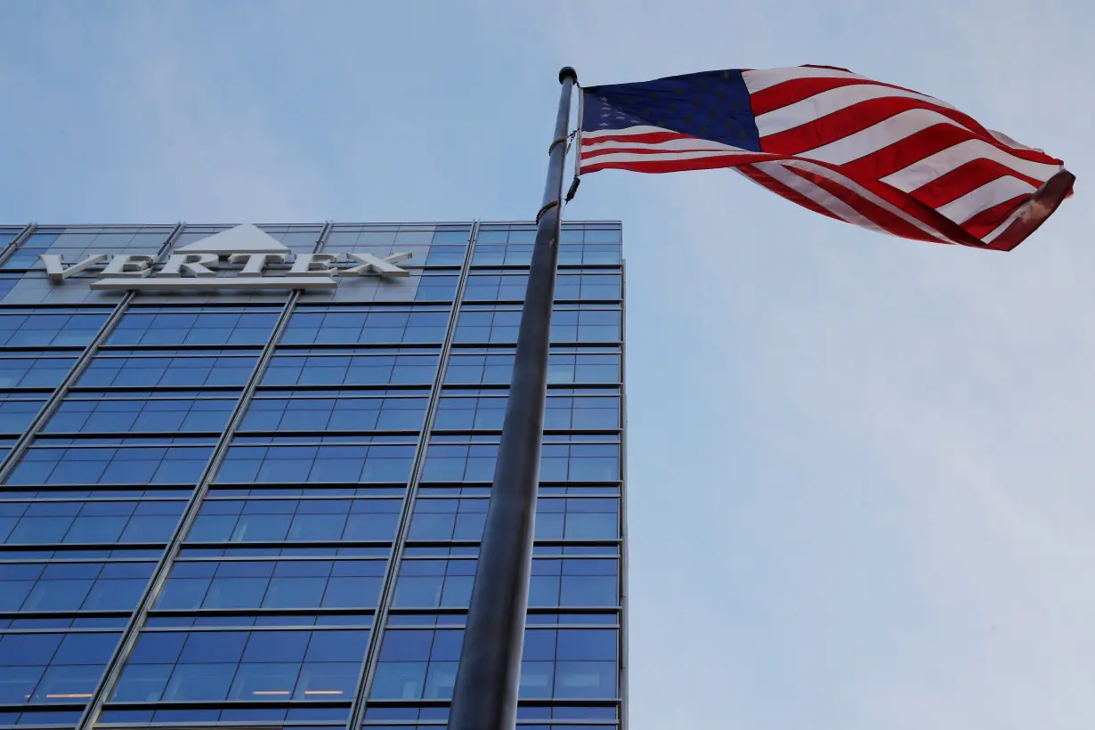 A U.S. flag flies next to the headquarters of Vertex in Boston