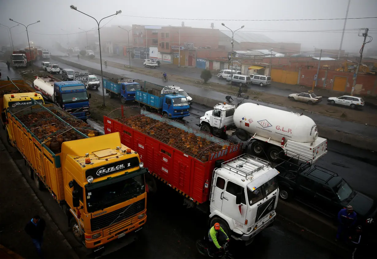 Trucks with gas cylinders and a gasoline tank truck are seen next petrol plant of Senkata outskirts of La Paz