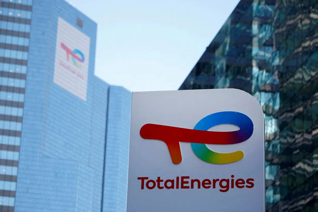 FILE PHOTO: FILE PHOTO: Logo of TotalEnergies at an electric vehicle fuelling station near Paris