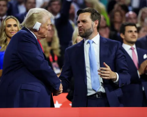 Trump appears with bandaged ear at Republican convention, names Vance as running mate